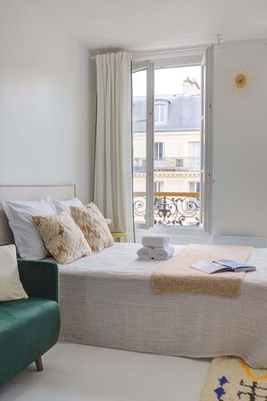 1 bedroom, desk, iron/ironing board, travel crib