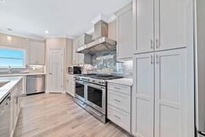 Fridge, microwave, oven, stovetop - NEW Aqua Vista by GSVR | Beachfront Home w/ Pool, Theater & Game Room + Free Activities/Golf (Gulf Shores)