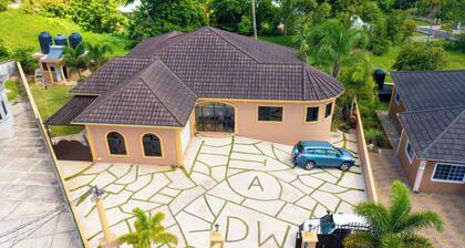 Spacious 2-bedroom apartment in Mandeville with hot tub ,WiFi and private garage