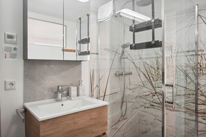 Shower, hair dryer, towels, soap