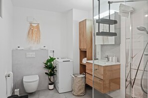 Shower, hair dryer, towels, soap