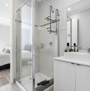 Shower, hair dryer, towels, soap