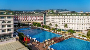 A hotel with multiple swimming pools, a rooftop bar, and a view of the surrounding landscape. - Grand Cortez Halal Family Hotel - All Inclusive  (Alanya)