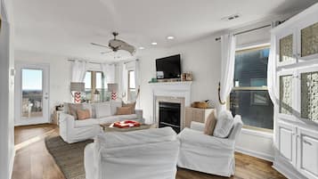 TV, fireplace, books