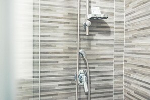 Shower, hair dryer, bathrobes, towels