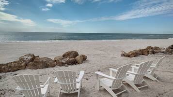 On the beach, sun loungers, beach towels