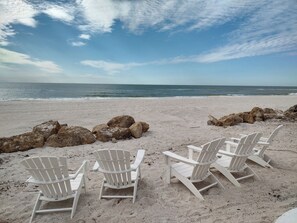 On the beach, sun-loungers, beach towels