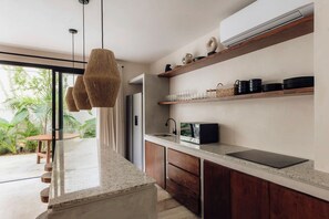 Fridge, microwave, stovetop, coffee/tea maker