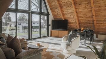 Älytelevisio, pöytäjalkapallopöytä, kirjoja, tulostin