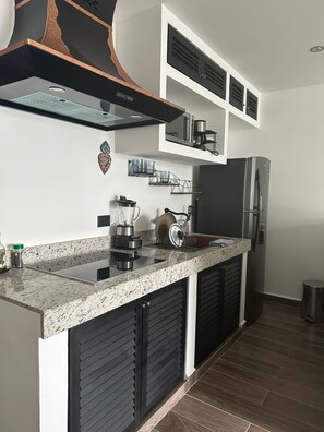 Fridge, microwave, stovetop, coffee/tea maker