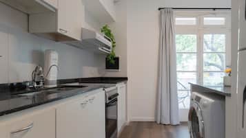 Casa adossada, vistes a la ciutat | Cuina privada