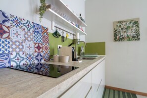 Fridge, microwave, stovetop, coffee/tea maker