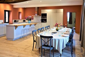 Enjoy meals in this well-equipped kitchen with a stove and oven, perfect for cooking and dining with friends and family.
