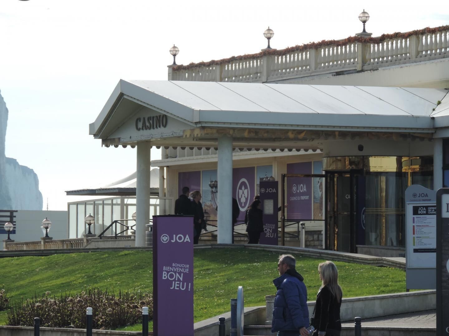 A casino with a sign reading "CASINO" and "JOA" logos.