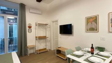 Deluxe Apartment, City View | Free minibar, in-room safe, desk, laptop workspace