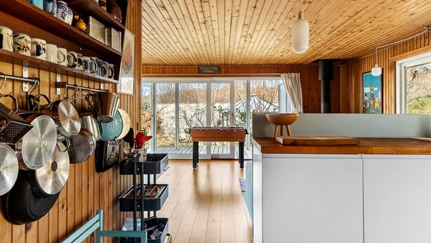 A kitchen with wooden cabinets, a wooden ceiling, and a view of the outdoors. - Gorgeous home in Vejby with WiFi (Vejby)