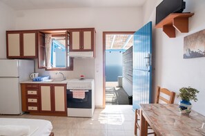 Fridge, electric kettle, cookware/dishes/utensils