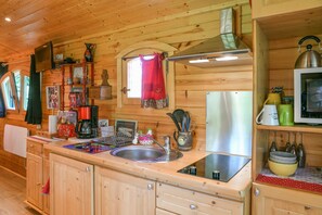 Fridge, microwave, stovetop, coffee/tea maker