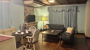 Suite Deluxe | Área de sala de estar