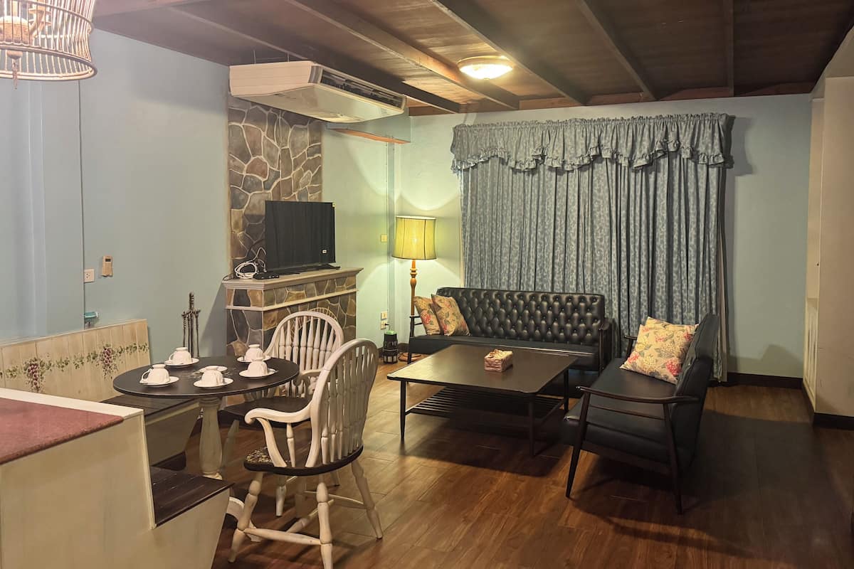 Suite Deluxe | Área de sala de estar