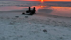 A beach with footprints and a wooden structure. - Beautiful 3 bedroom house in Villas NJ- dishwasher, washer/dryer, and ac. (Lower Township)