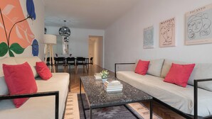 A modern living room with a sofa, coffee table, and artwork on the walls. - MOT Charcas 3000 (Buenos Aires)