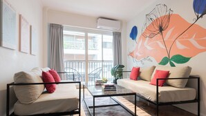 A modern living room with a sofa, a coffee table, and a balcony view. - MOT Charcas 3000 (Buenos Aires)