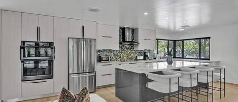 Oven, stovetop, cookware/dishes/utensils, dining tables