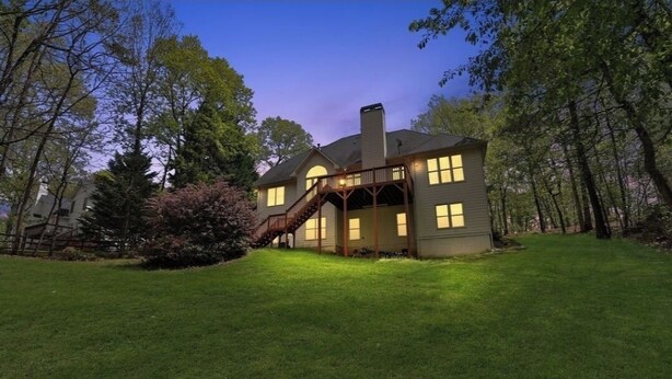 A two-story house with a covered porch and a chimney. - Spacious and comfy 4 Bed/3 Full Bath Canton Home! (Canton)