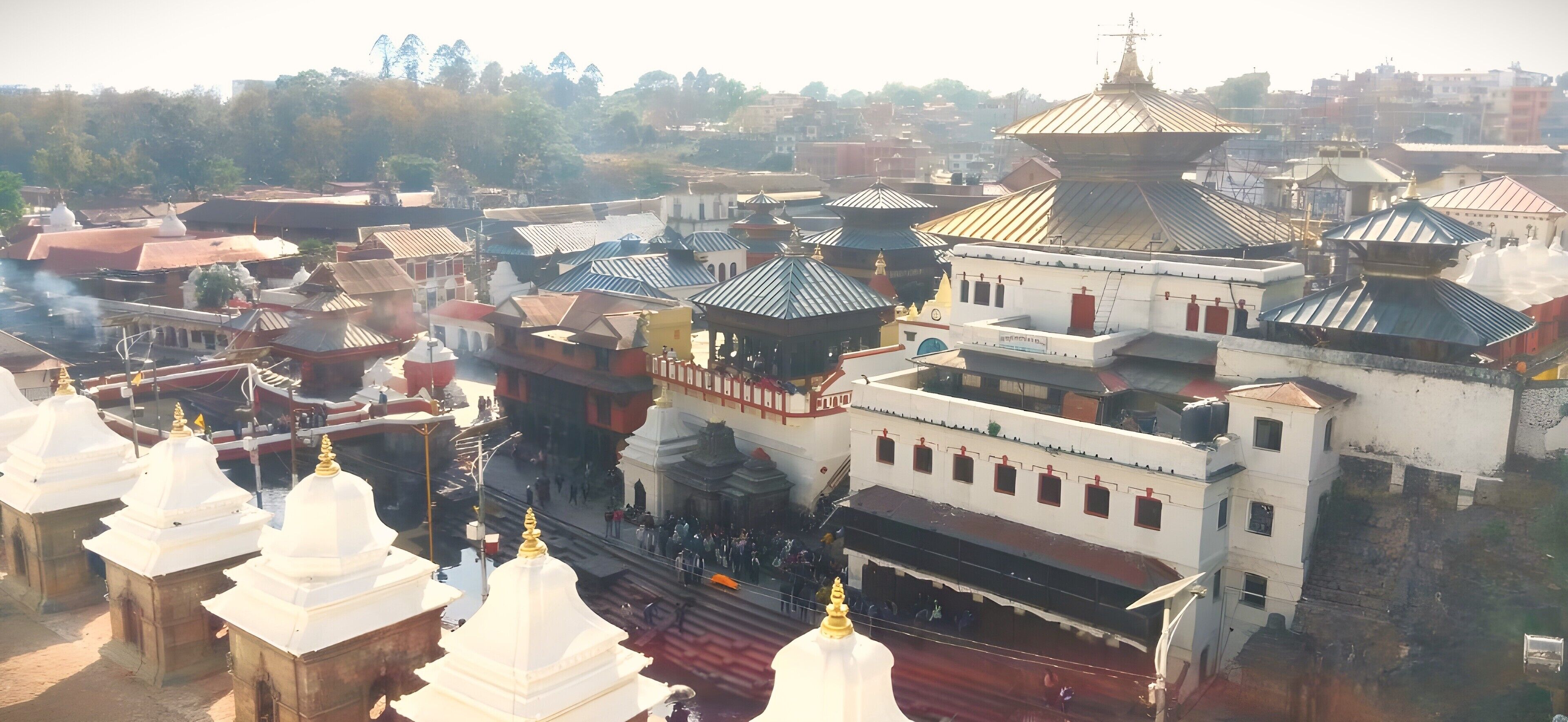 A large temple complex with multiple pagodas and a central building with a large dome.