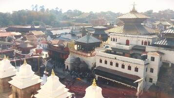 A large temple complex with multiple pagodas and a central building with a large dome.