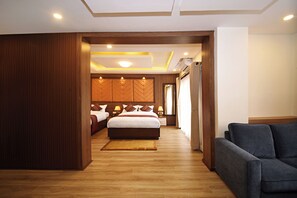 Chambre Triple Deluxe | Coin séjour