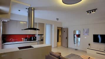 Familjesvit - utsikt mot staden | Vardagsrum | Tv och printers