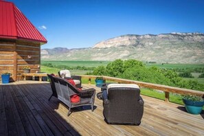 Terrace/patio - Red Roof Ranch, is located on 15 acres with stunning mountain and lake views! (Cody)