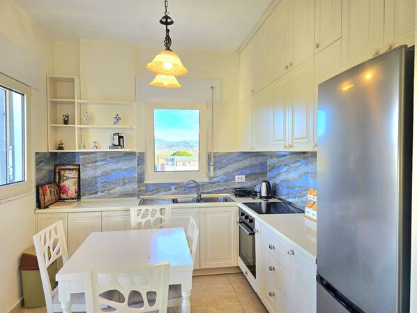 Fridge, oven, electric kettle, cookware/dishes/utensils