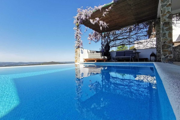 Seasonal outdoor pool, open 10:00 AM to 8:00 PM, pool umbrellas