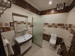 Slippers, soap, shampoo, toilet paper