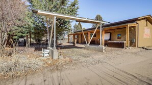 A rustic cabin with a covered outdoor seating area, a sauna, and a small outdoor kitchen. - Artsy Studio w/ Patio: 25 Mi to Santa Fe (Espanola)