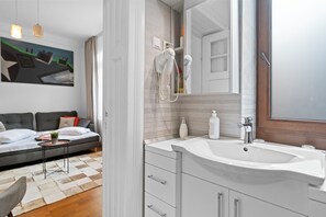 Shower, hair dryer, towels, soap