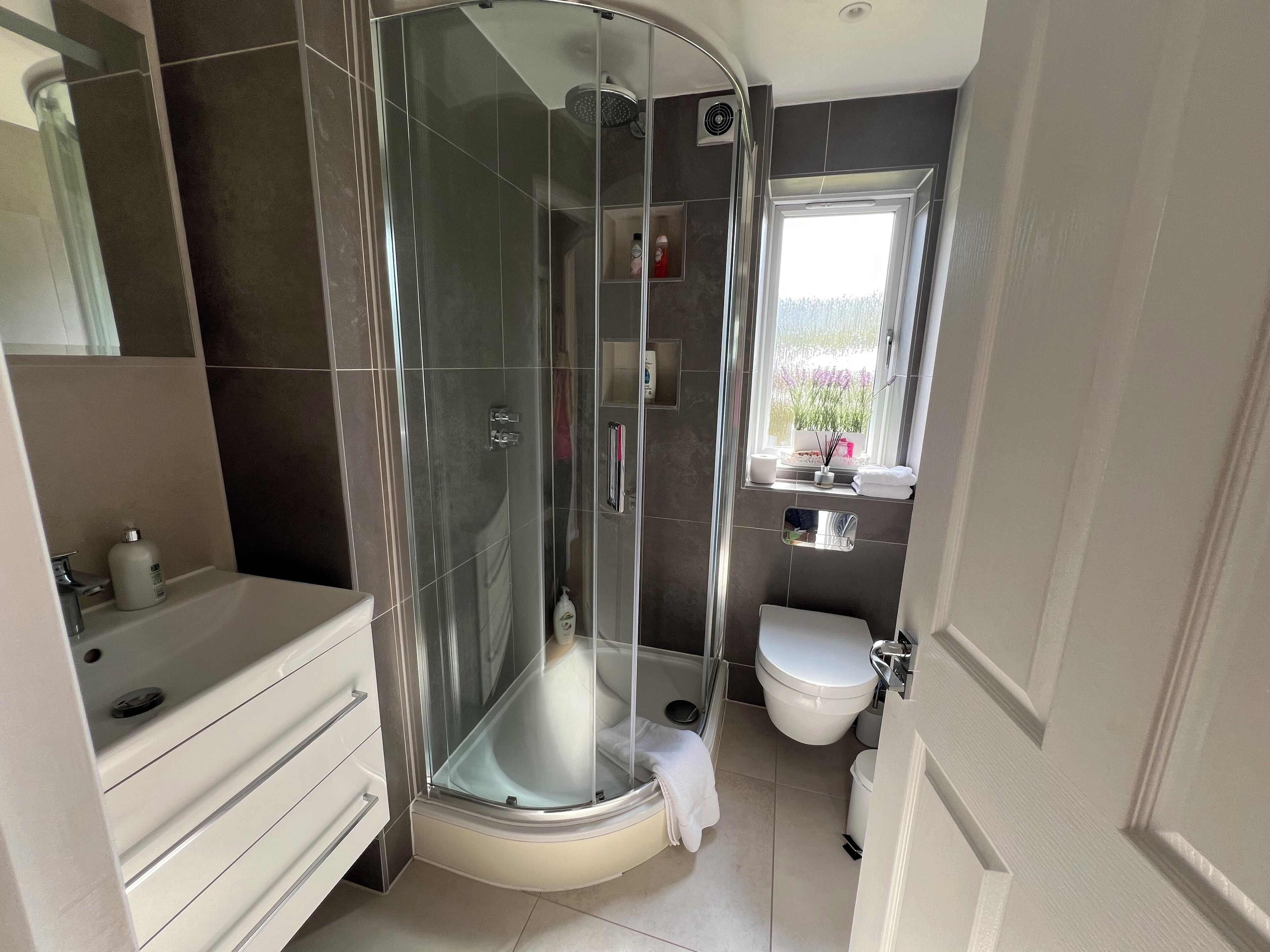 Shower, hair dryer, towels, soap