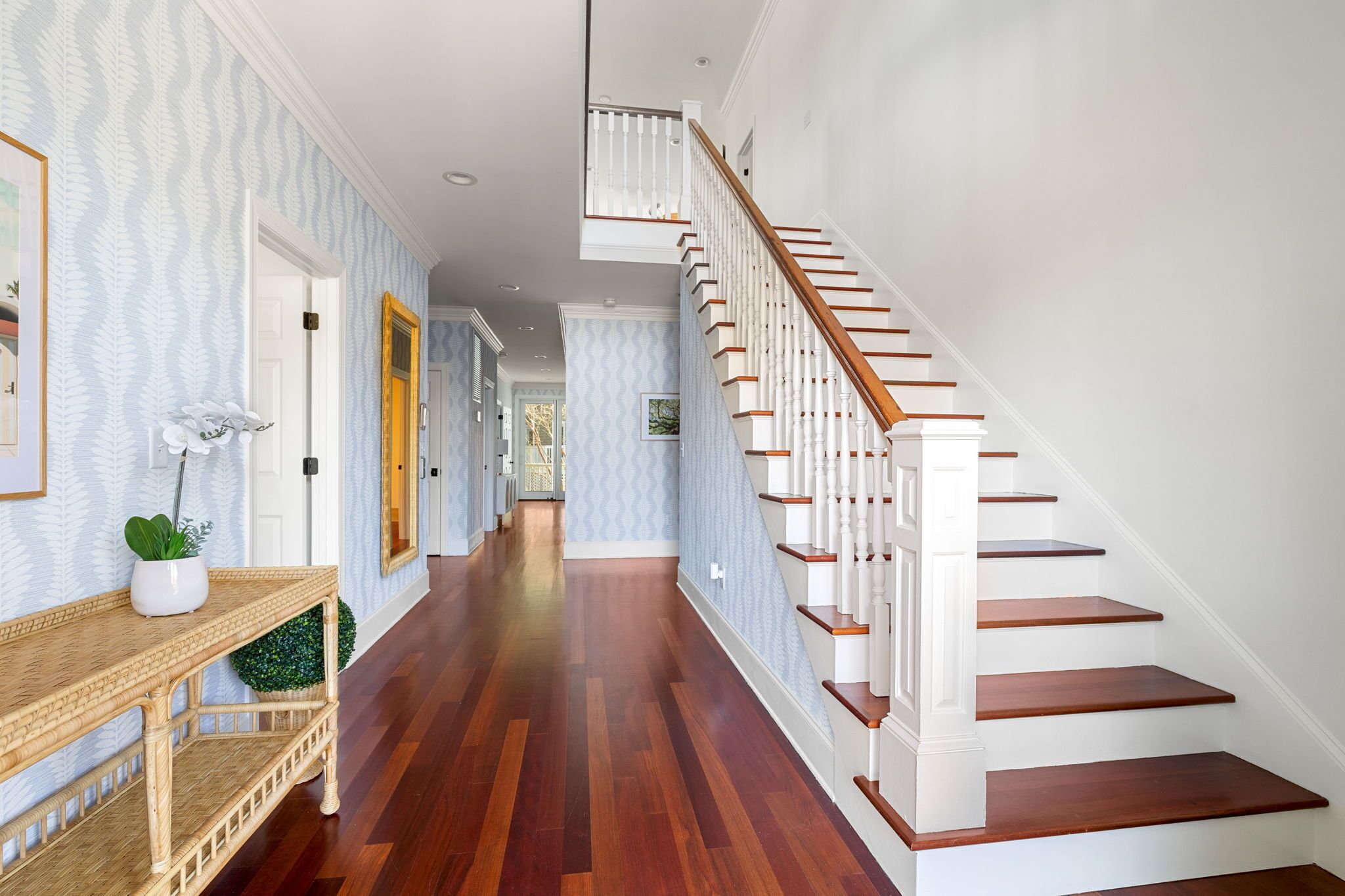 Just inside the front door, you will be welcomed by a beautiful, tropical foyer.