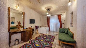 Queen Cave Room | Select Comfort beds, minibar, laptop workspace, free WiFi