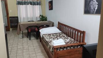 Departamento Confort | Área de sala de estar | Televisión de pantalla plana