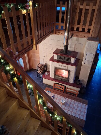 A large gîte all dressed in wood inside, with a lovely decor.