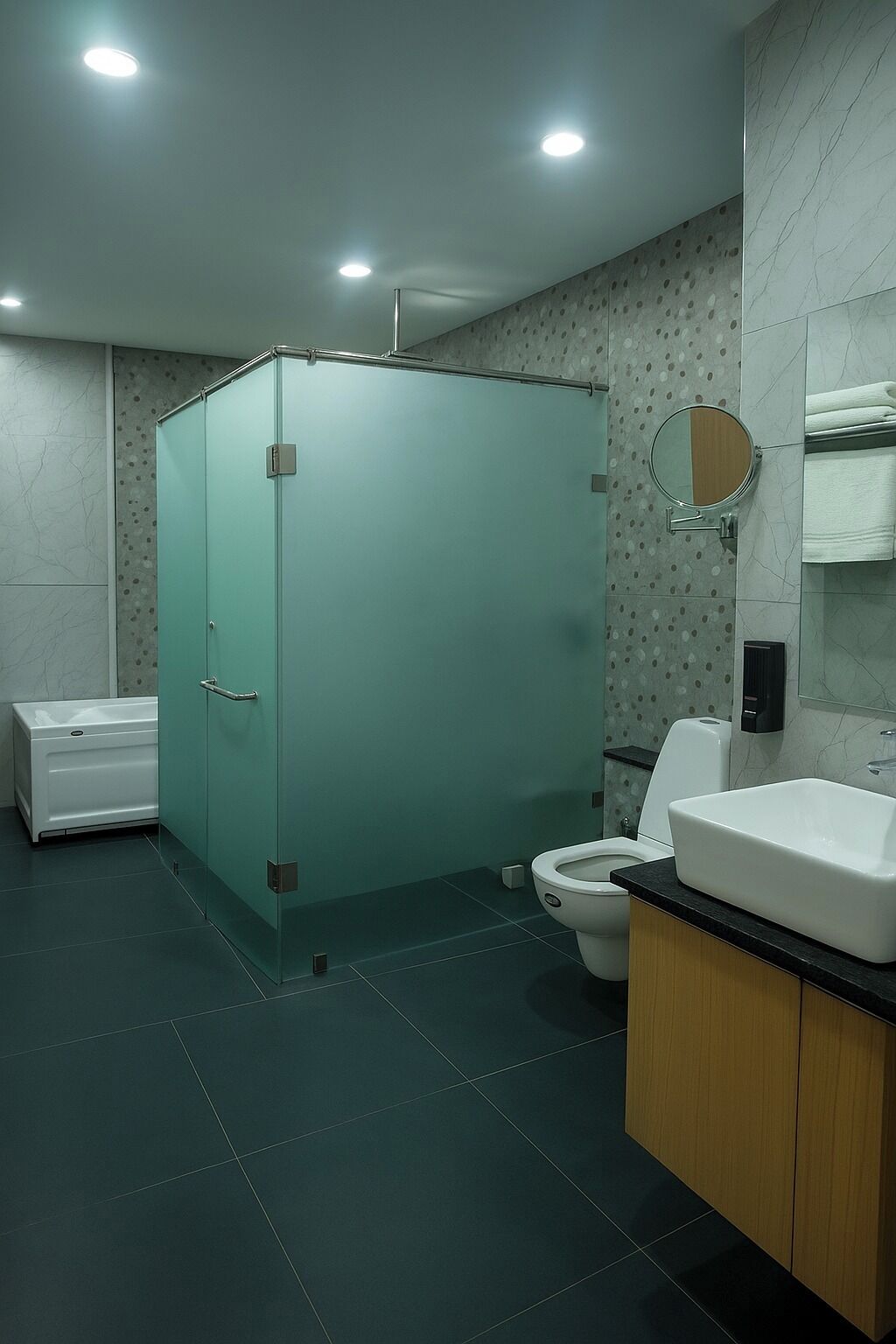 A bathroom with a glass shower enclosure, a toilet, a sink, and a bathtub.