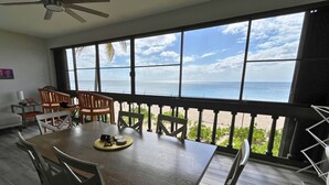 A dining area with a view of the beach. - Leisure Daze by the Sea (Frederiksted)