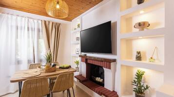 Luxury House, Garden View | Living area | 32-inch Smart TV with digital channels
