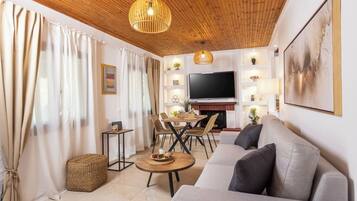 Luxury House, Garden View | Living area | 32-inch Smart TV with digital channels
