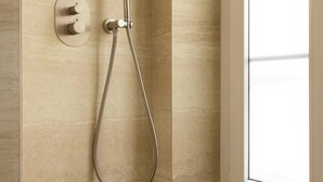 A shower with a handheld showerhead and a wall-mounted control panel. - Charming Studio With AC - 2P- Musee du Louvre (Paris)