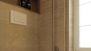 A modern bathroom with a white toilet, a shower enclosure, and a window providing natural light. - Charming Studio With AC - 2P- Musee du Louvre (Paris)